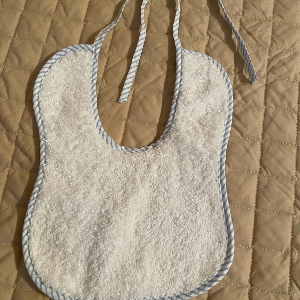 Handmade Bib white with blue trim, tie closure, brand new.